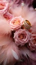 Elegant wedding dacor featuring gold rings, Eustoma roses, and light pink feathers Royalty Free Stock Photo