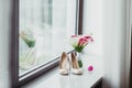 Elegant wedding flower bouqet and shoes near the window Royalty Free Stock Photo