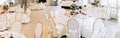 Elegant wedding reception white table arrangement, floral centerpiece decoration, restaurant