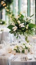 Elegant wedding table decoration with many candles and flowers, predominantly white color