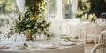 Elegant wedding table decoration with many candles and flowers, predominantly white color