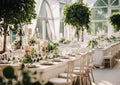 Elegant wedding table decoration with many candles and flowers, predominantly white color