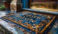 Elegant welcome mat placed at the front door of a home, offering a warm greeting with ornate patterns on a coir doormat