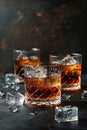 Elegant whiskey glasses with ice on dark background, luxury spirits tasting Royalty Free Stock Photo