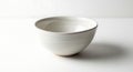 Elegant White Ceramic Bowl on White Background, Minimalist Kitchenware Royalty Free Stock Photo