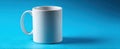 The elegant white ceramic mug on a vibrant blue background.AI generated image Royalty Free Stock Photo