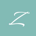 Elegant white cursive letter z initial monogram in a beautiful soft muted teal background creating a sophisticated visual identity Royalty Free Stock Photo