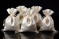 Elegant White Drawstring Bags with Golden Pendants Royalty Free Stock Photo