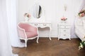 Elegant white dressing table in light luxury interior.