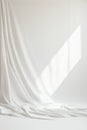 Elegant white fabric drape with light and shadow in minimalist setting Royalty Free Stock Photo