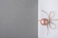 Elegant White Gift Box Tied with Twine with Pink Decoration Ball Hanging. Christmas New Years Presents Shopping Sale. Gray