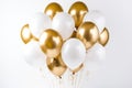 Elegant white and gold balloon with intricate patterns floating on a pure white background Royalty Free Stock Photo