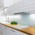 Elegant white kitchen with led lights, close-up Royalty Free Stock Photo