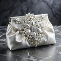 An elegant white satin pouch adorned with crystal embellishments