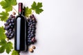 Elegant Wine Delight Bottle of Red Wine with Ripe Grapes and Vine Leaves on Crisp White Background. created with Generative AI Royalty Free Stock Photo