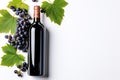 Elegant Wine Delight Bottle of Red Wine with Ripe Grapes and Vine Leaves on Crisp White Background. created with Generative AI Royalty Free Stock Photo