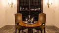 Elegant Wine Tasting Setup with Decanter and Wine Rack in a Luxurious Cellar Royalty Free Stock Photo