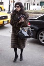 An elegant woman arriving to a Fashion show in New York