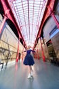 Elegant woman in blue long flying dress posing at stairway against old city building Royalty Free Stock Photo