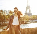 Elegant woman on embankment in Paris looking into the distance Royalty Free Stock Photo