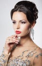 Elegant woman with evening hairstyle and earrings.