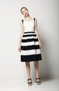 Elegant Woman Fashion Model in Light Striped Cotton Sundress. Vogue Style