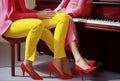 red woman legs trend fashion piano colourful young elegant erotic modern. Generative AI. Royalty Free Stock Photo