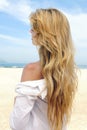 Elegant woman with long blond hair at the beach Royalty Free Stock Photo