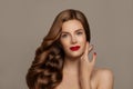 Elegant woman with long red healthy curly hair. Pretty redhead girl, fashion beauty portrait Royalty Free Stock Photo