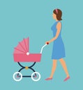 Elegant woman with pink carriage baby walking