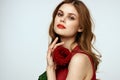 Elegant woman red dress rose in glamor cropped hands Royalty Free Stock Photo