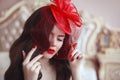 Elegant woman in retro hat with red lips and manicured nails. Br Royalty Free Stock Photo