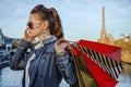 Elegant woman with shopping bags speaking on mobile phone, Paris Royalty Free Stock Photo