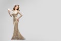 Elegant Woman in Sparkling Evening Dress, Happy Fashion Model in Long Lace Gown, Beauty Studio Portrait Royalty Free Stock Photo