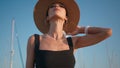 Elegant woman straw hat posing at beautiful blue sky closeup. Portrait chic girl Royalty Free Stock Photo