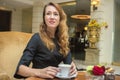 Elegant woman at a table Royalty Free Stock Photo