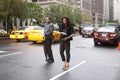 An elegant woman waiting for a taxi on Fifth avenue