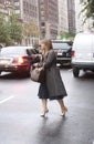 An elegant woman waiting for a taxi on Fifth avenue