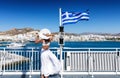 Elegant woman on a ferry boat in the Cyclades of Greece Royalty Free Stock Photo