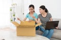 Elegant women buyer opening shipping parcel