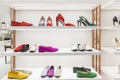 Elegant women`s shoes on the shelves in a boutique. Shoes, boots and boots. Fashion & Style. Front view Royalty Free Stock Photo