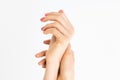 Elegant womens hands with a beautiful manicure on a white background. Close up