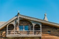 Elegant wooden balcony. Fragment of the facade. Old traditional peasant house in the north of Russia. Kizhi, Russia Royalty Free Stock Photo