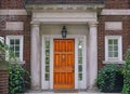 Elegant wooden front door and stone columns