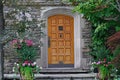Elegant wooden front door of stone house Royalty Free Stock Photo