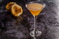 Elegant yellow passion fruit cocktail in martini glass Royalty Free Stock Photo