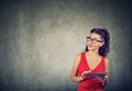 Elegant young businesswoman in red dress using tablet Royalty Free Stock Photo