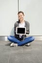 Elegant young businesswoman using tablet leaning to wall Royalty Free Stock Photo