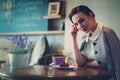 Elegant young lady alone in a cafe Royalty Free Stock Photo