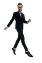 Elegant young man in black suit holding hands in a fashion pose Royalty Free Stock Photo